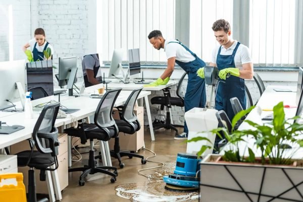 multicultural-team-of-cleaners-working-in-modern-open-space-office.jpg